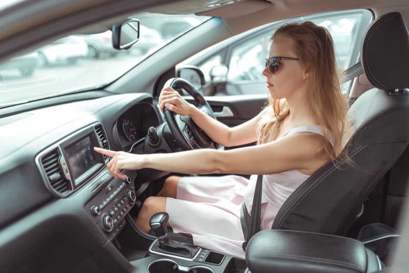Stylish Woman Driving Selecting Screen