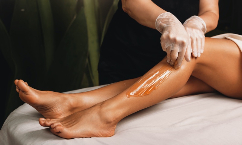 Woman Getting Legs Waxed Professional