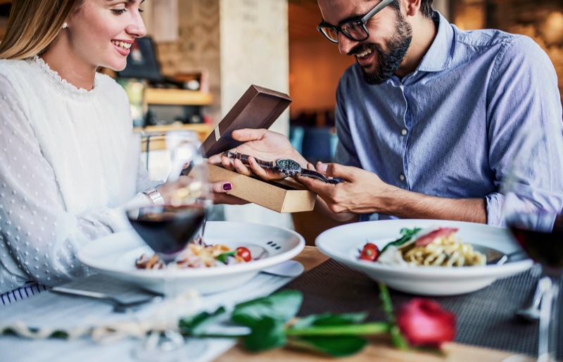 Woman Giving Man Gift Watch