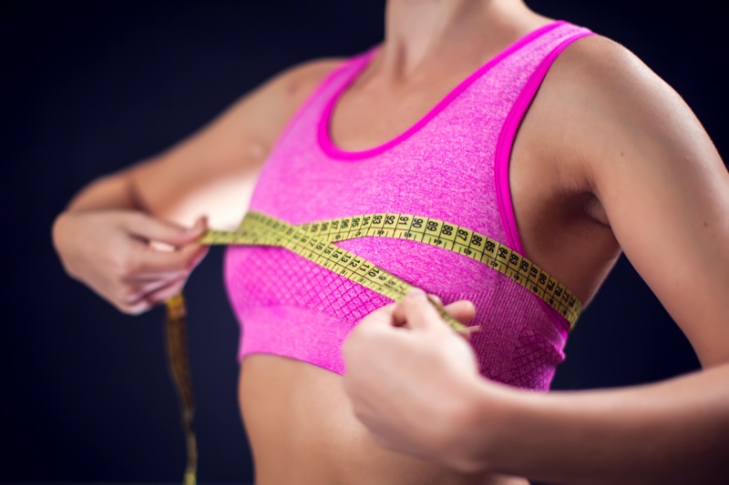 Woman Measuring Sports Bra