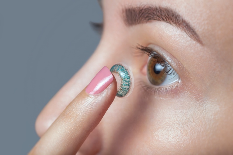 Woman Using Blue Color Contact Lenses