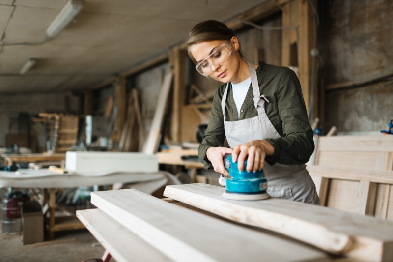 Woman Woodworker Sanding