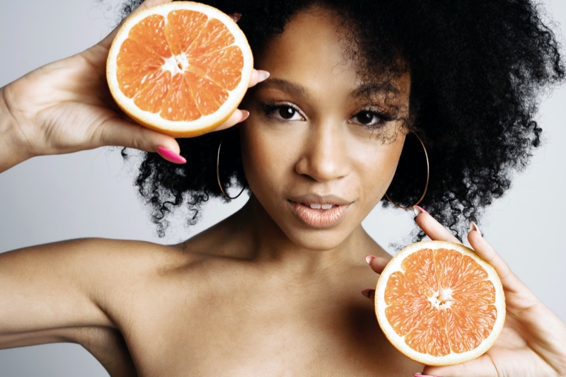 Black Model Holding Grapefruit Beauty