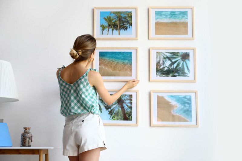 Girl Hanging Pictures Wall