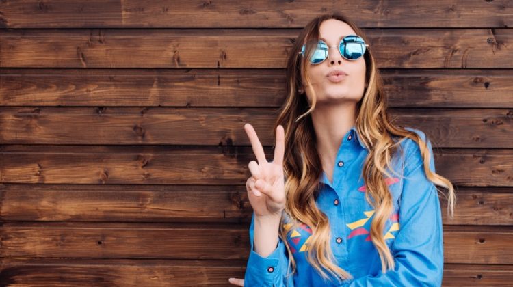 Model Throwing Peace Sign Sunglasses Blue Shirt