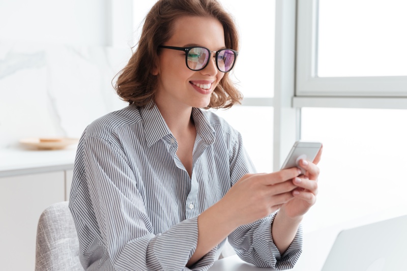 Woman Using Smartphone Wearing Glasses