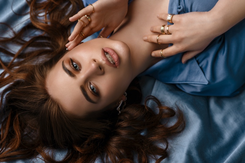 Beauty Model Blue Shirt Multiple Rings