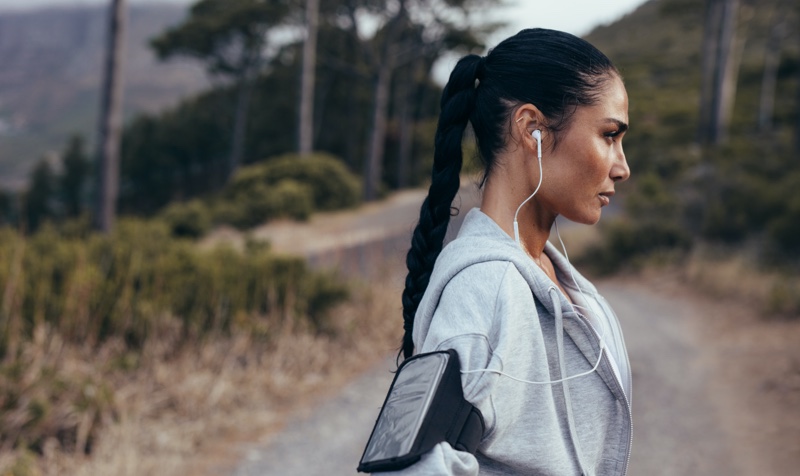 Brunette Model Ponytail Earbuds Grey Hoodie