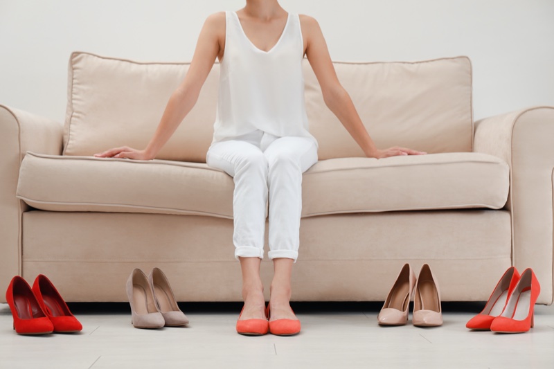 Woman Trying Shoes Couch Flats Heels