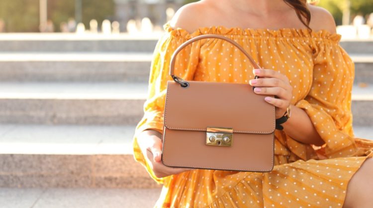 Woman Yellow Dress Holding Beige Handbag