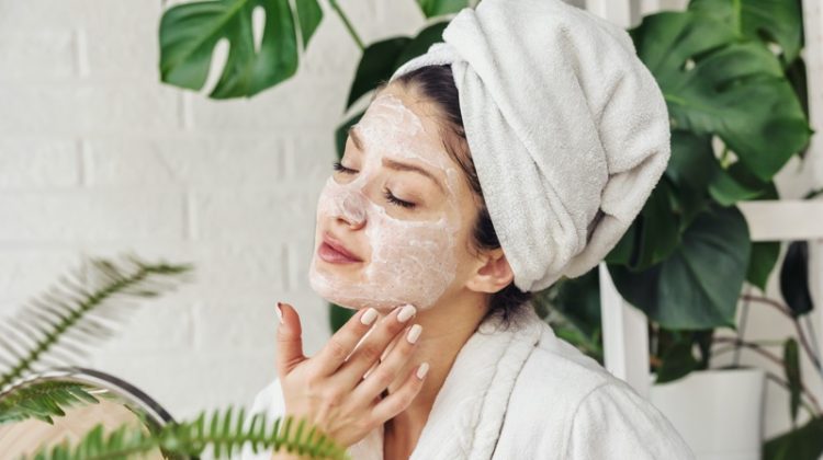 Attractive Woman Applying Face Mask