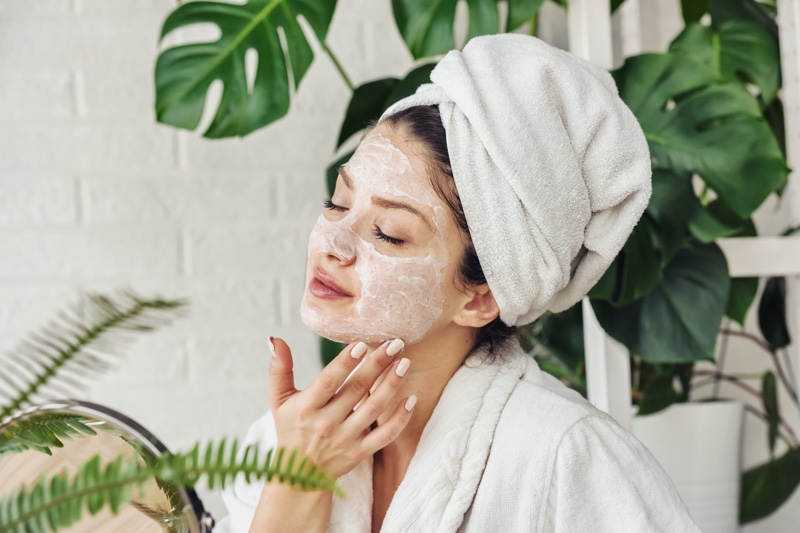 Attractive Woman Applying Face Mask