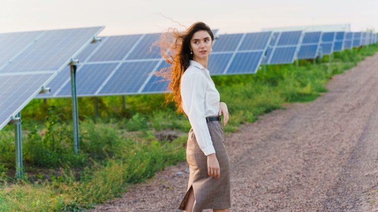 Attractive Woman Walking Solar Panels Outdoors