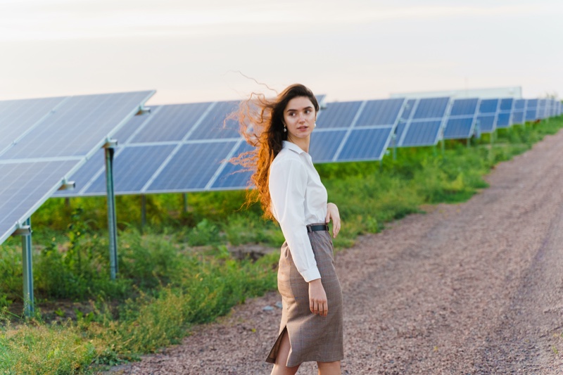 Attractive Woman Walking Solar Panels Outdoors