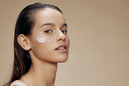 Face & Body Care Routine: How to Find the Right Approach to Keep Them Healthy Happy Model Holding Bottle Face Toner