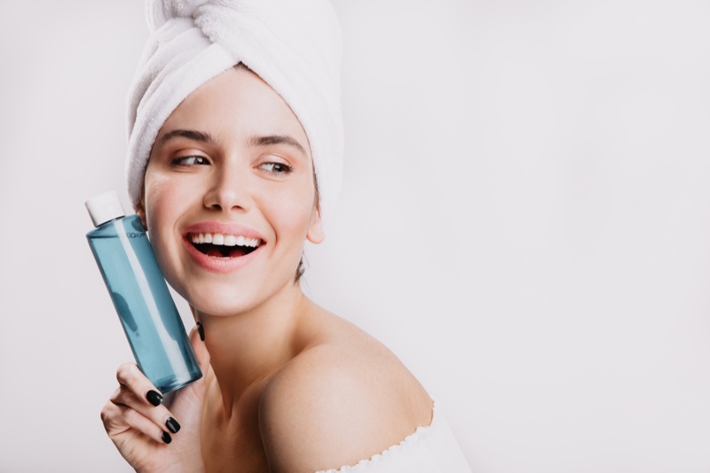 Happy Model Holding Bottle Face Toner