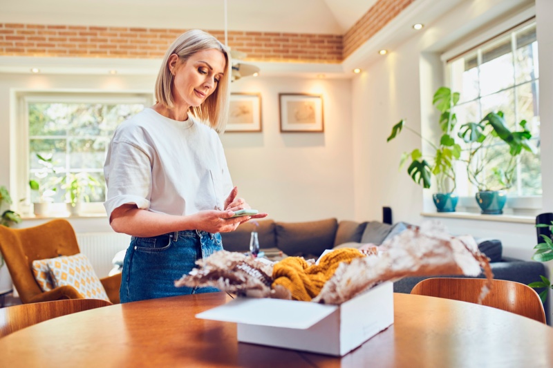 Middle Age Woman Packing Order Clothing