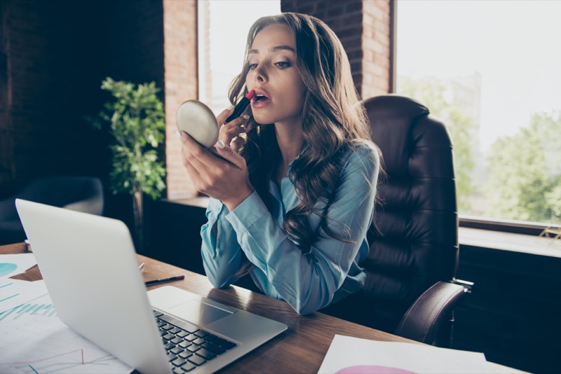 Woman Professional Applying Lipstick