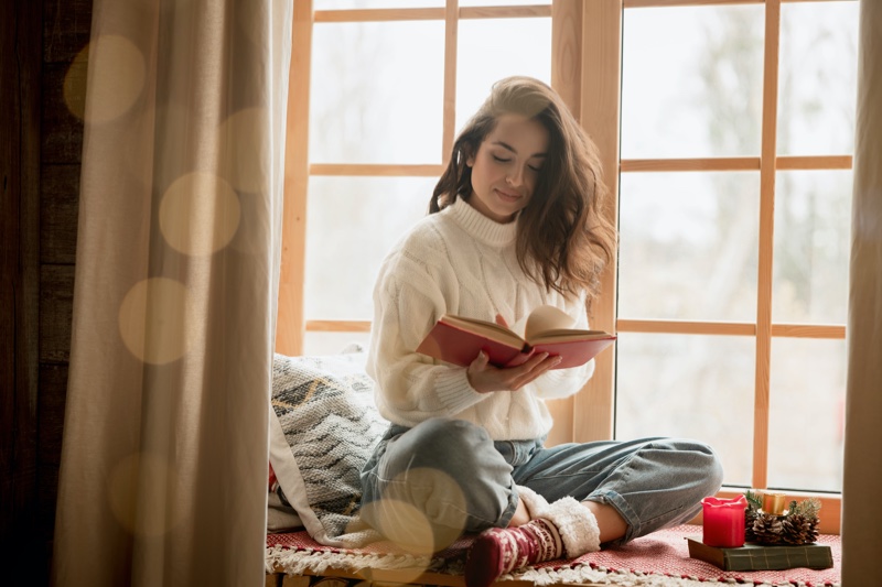 Woman Reading Book Christmas Time Window