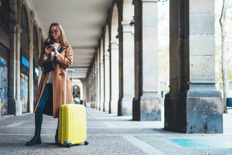 Young Woman Travel Yellow Suit Case Coat