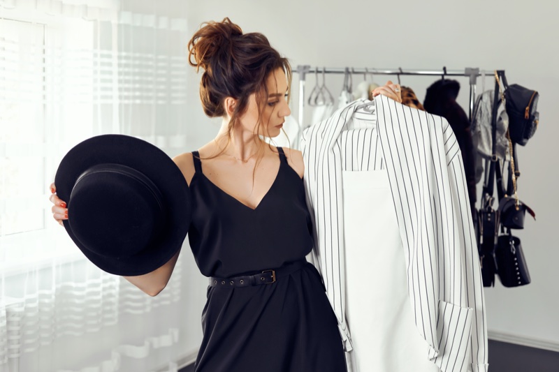 Attractive Woman Selecting Clothes Hat