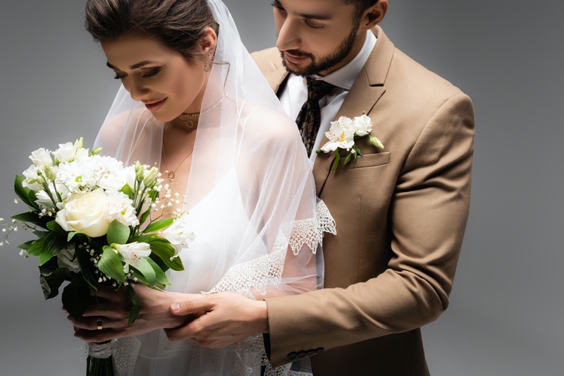 Couple Wedding Studio Flowers Tan Suit Veil