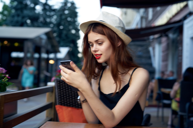 Model Looking Phone Cafe