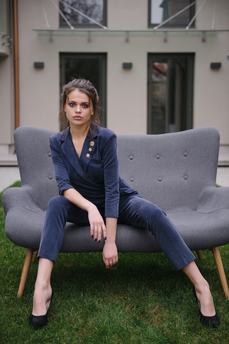 Model Posing Loveseat Couch Jacket Pants Outside