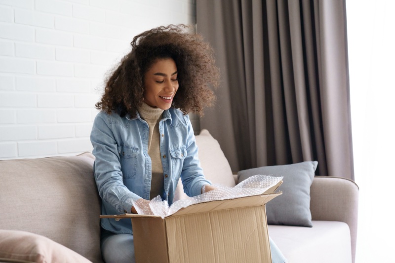 Woman Opening Package