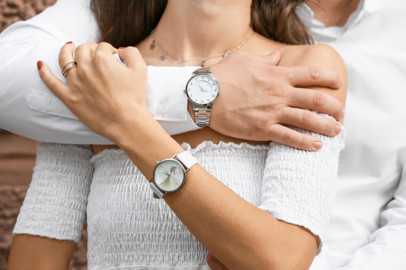 Couple Embracing Watches