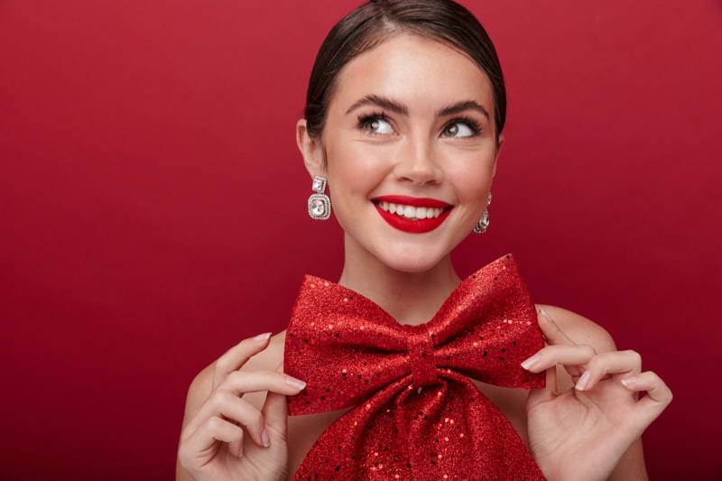 Smiling Model Red Lipstick Bow Christmas Theme Earrings