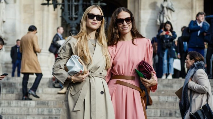 Two Women Fashion Week Tan Coat Pink Dress Bags