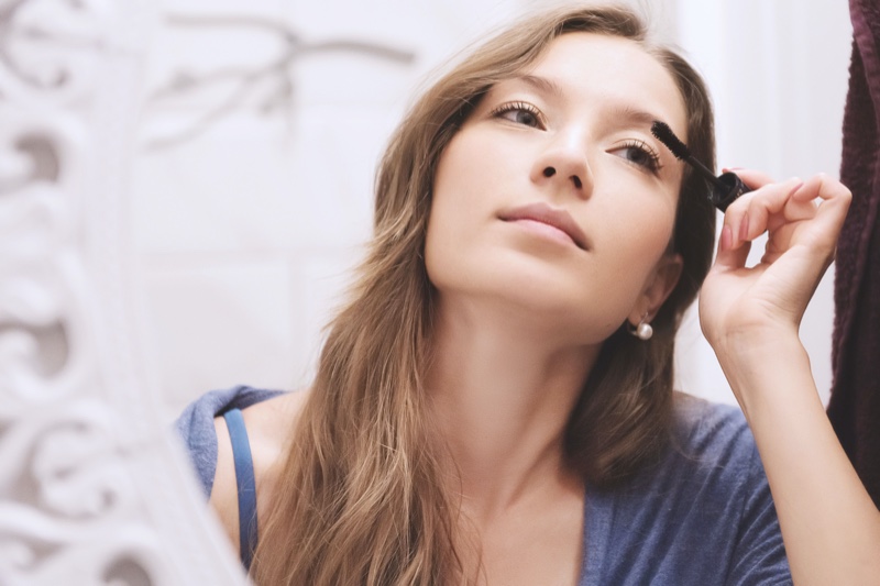 Woman Applying Mascara Mirror