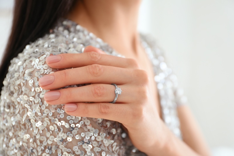 Woman Sequins Wearing Engagement Ring
