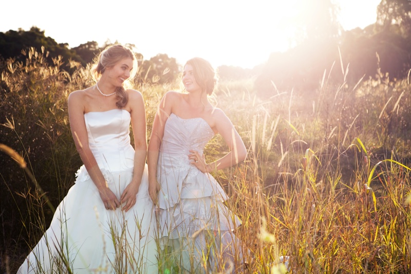 bride bridesmaid strapless dresses outdoors field