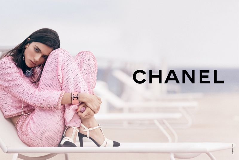Chanel features a pink tweed suit in its Cruise 2023 campaign.