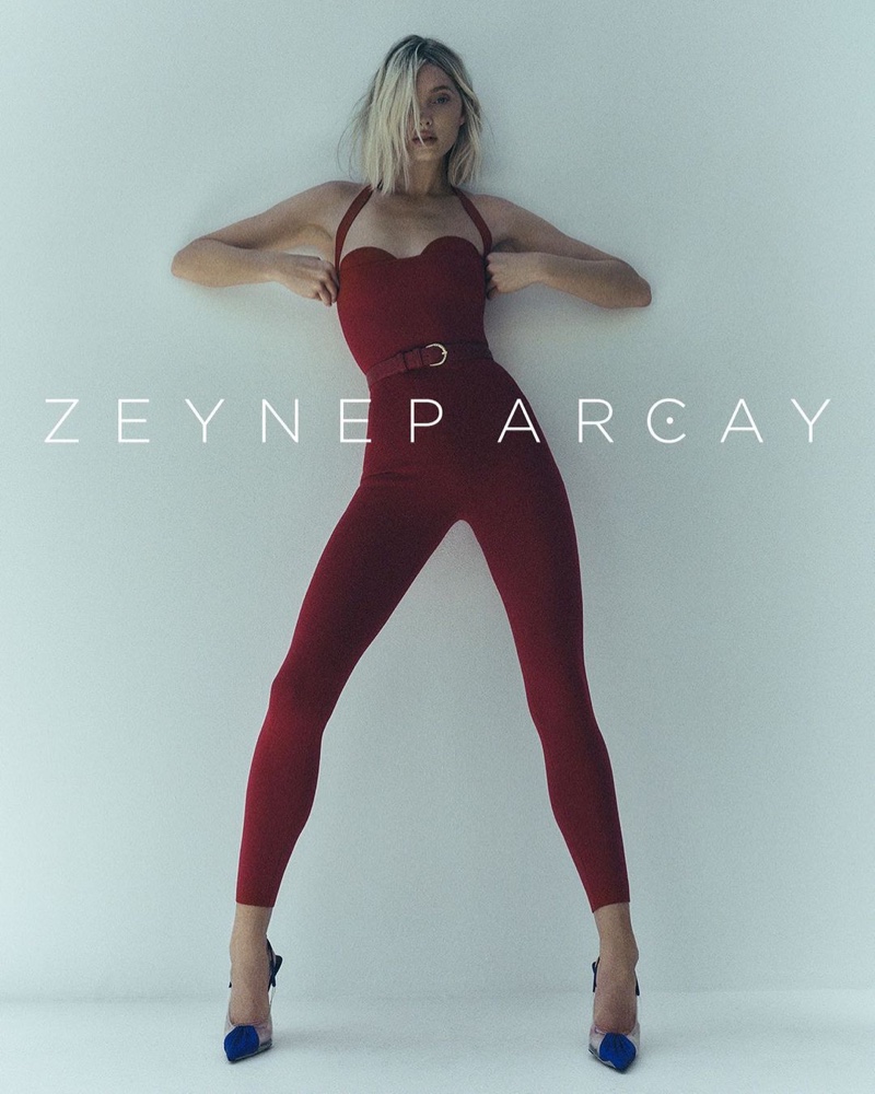 Dressed in a red top and pants, Elsa Hosk fronts Zeynep Arçay resort 2023 campaign.
