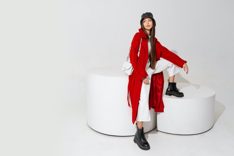 Model Red Coat White Pants Boots Outfit