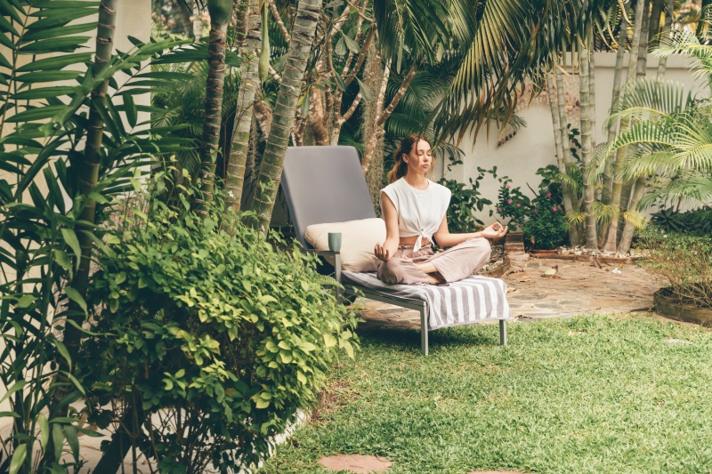 sunlounger woman small backyard