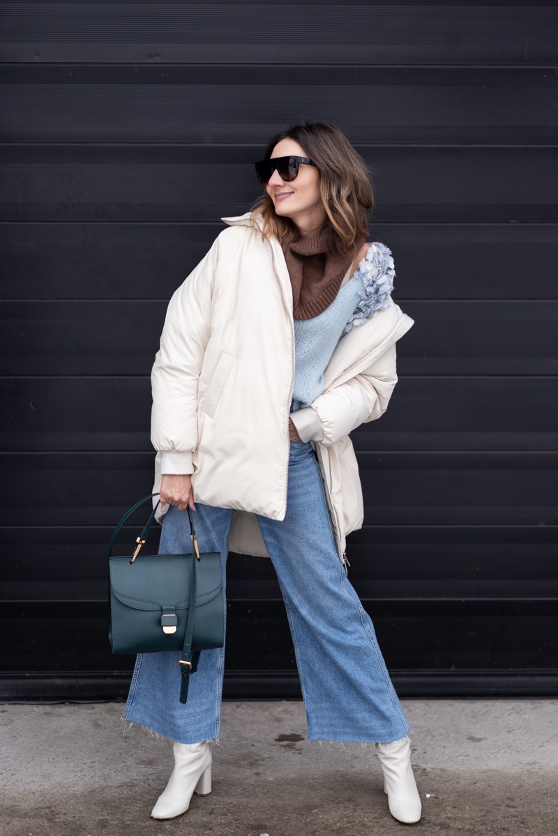 white puffer jacket wide leg jeans outfit bag boots