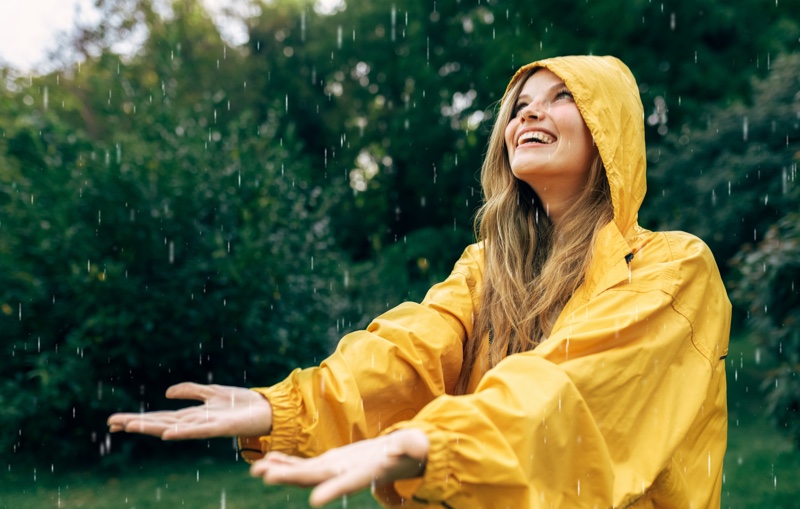 yellow raincoat woman happy