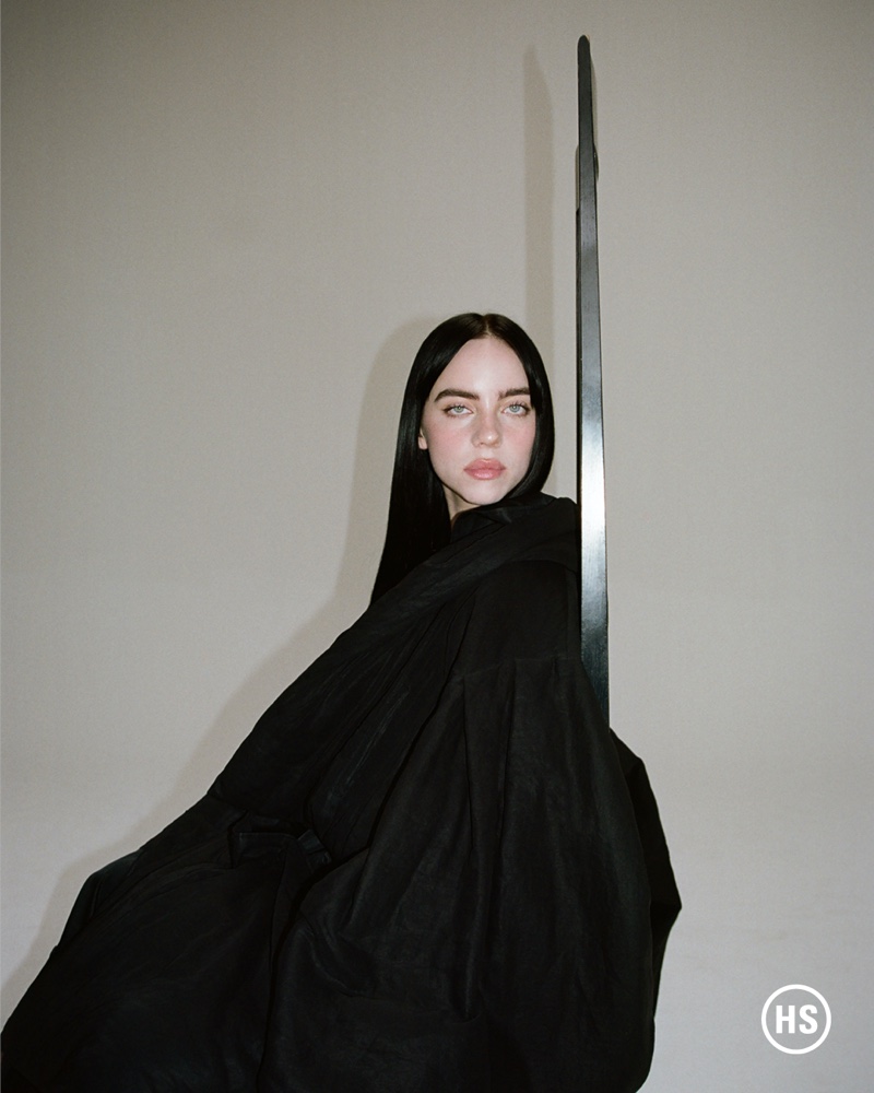 Clad in black, Billie Eilish wears Yohji Yamamoto coat.