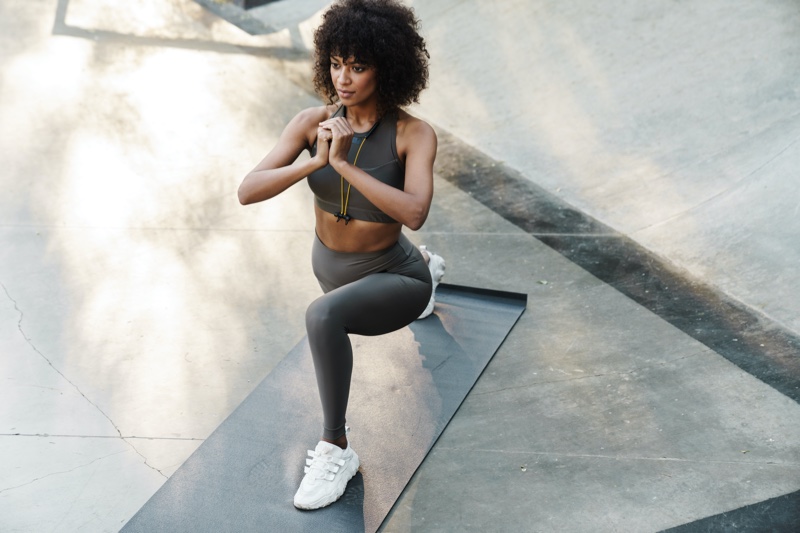 black woman lunges exercising fitness