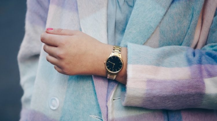 cropped woman plaid coat gold watch