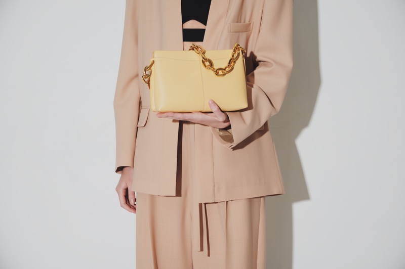 cropped yellow bag gold tone chain beige suit