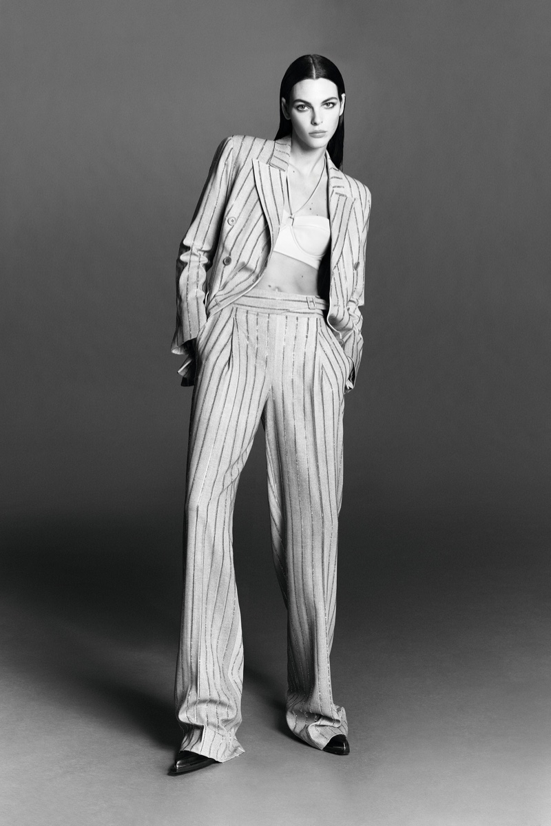 Wearing a pinstripe suit, Vittoria Ceretti poses for Ermanno Scervino spring-summer 2023 campaign.