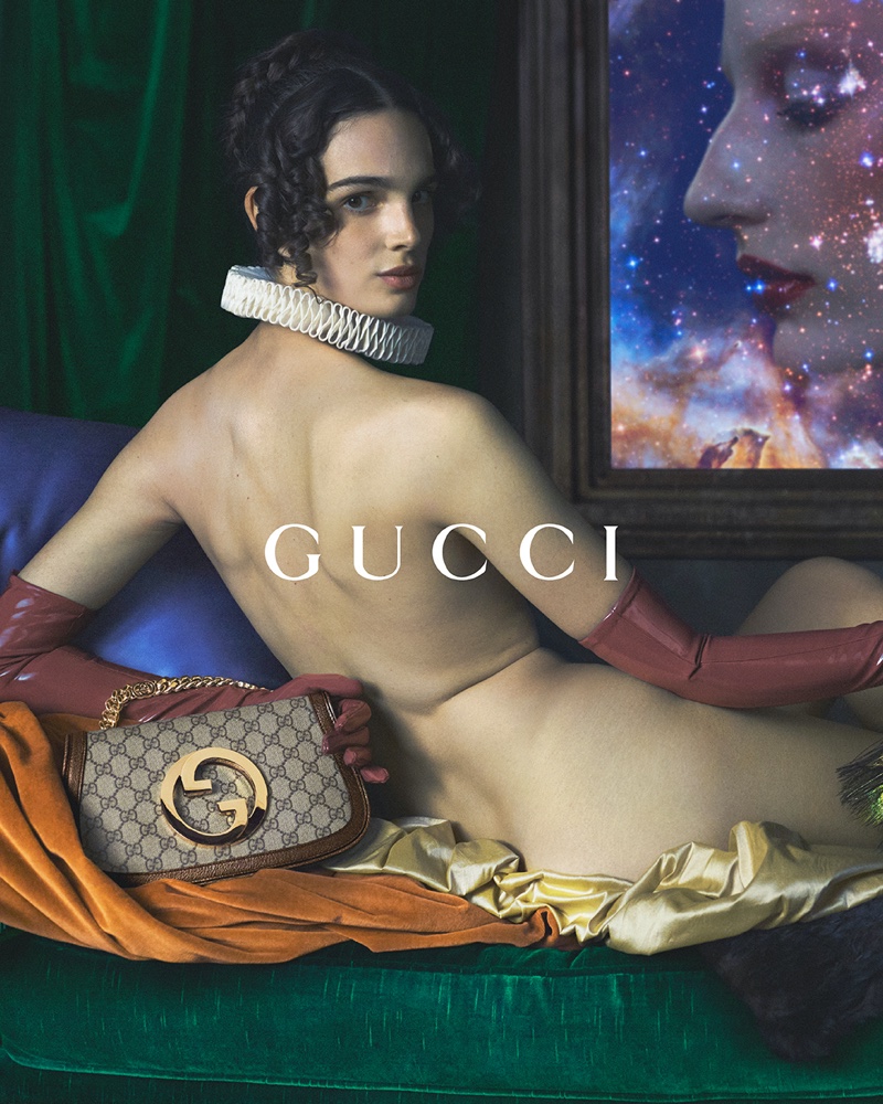 Looking like a painting, a model poses with the Gucci Blondie bag for Gucci Cosmogonie cruise 2023 campaign.