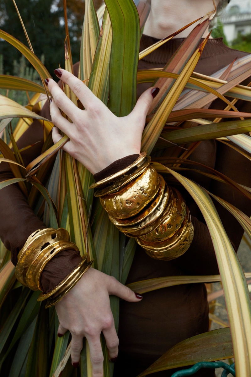 Textured gold jewelry stands out in Saint Laurent winter 2022 collection.