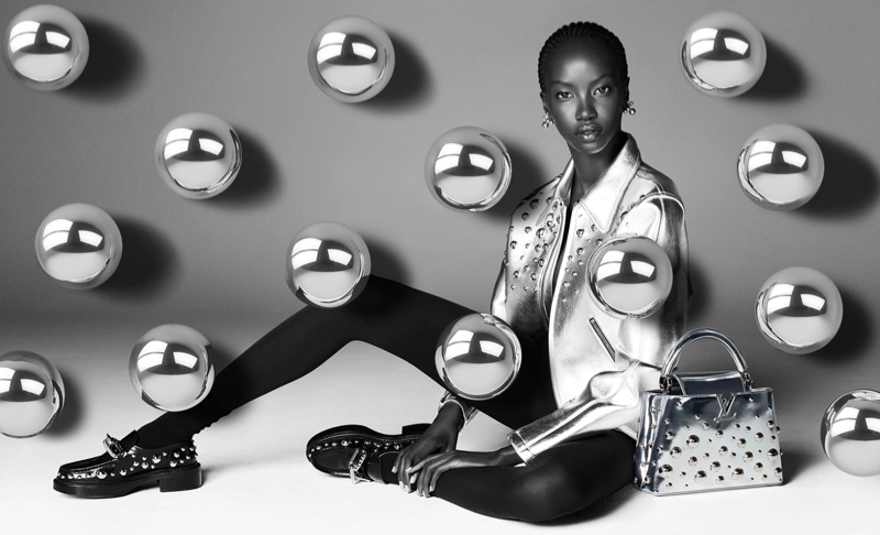 Anok Yai poses in Louis Vuitton x Yayoi Kusama 2023 campaign.