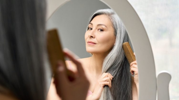 older woman grey hair mirror
